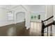 Open-concept living space with hardwood floors, archways, and abundant natural light at 198 Wrangell Dr, Mooresville, NC 28117