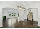 Spacious living area featuring hardwood floors, a cozy fireplace, and a staircase at 198 Wrangell Dr, Mooresville, NC 28117