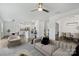 Open-concept living room with modern furnishings and seamless flow to the kitchen and dining areas at 198 Wrangell Dr, Mooresville, NC 28117