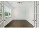 Empty room with large windows and hardwood floors, perfect for a home office or study at 198 Wrangell Dr, Mooresville, NC 28117