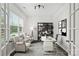 Bright home office with large windows, modern furnishings, and stylish decor at 198 Wrangell Dr, Mooresville, NC 28117