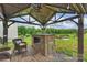 Backyard gazebo featuring a built-in outdoor kitchen, perfect for entertaining and enjoying outdoor meals at 198 Wrangell Dr, Mooresville, NC 28117