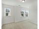 Well-lit room featuring two windows, neutral carpet and white walls at 198 Wrangell Dr, Mooresville, NC 28117
