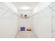 Spacious walk-in closet with ample shelving and storage space for organization at 198 Wrangell Dr, Mooresville, NC 28117