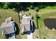 Expansive backyard featuring a patio area with a fire pit, pergola, and lush landscaping at 2035 Beacon Ave, Monroe, NC 28110