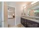 Bathroom with double vanity, granite counters, and an open view to the bright main bedroom at 2035 Beacon Ave, Monroe, NC 28110