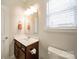 Bathroom featuring a single vanity, dark cabinets, and natural lighting at 2035 Beacon Ave, Monroe, NC 28110