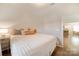 Clean bedroom featuring wood-look floors and neutral walls, open to kitchen and dining areas at 2035 Beacon Ave, Monroe, NC 28110