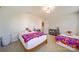 Bedroom featuring two beds with sporty Clemson decor, and light neutral carpet at 2035 Beacon Ave, Monroe, NC 28110