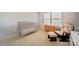 Charming Bedroom featuring a crib, a dresser, and a rocking chair bathed in natural light at 2035 Beacon Ave, Monroe, NC 28110