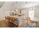 Open kitchen showcases a large island with seating, modern pendant lighting, and stainless steel appliances at 2035 Beacon Ave, Monroe, NC 28110