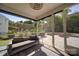 Relaxing screened-in porch is perfect for enjoying backyard views with outdoor kitchen and stone patio at 2035 Beacon Ave, Monroe, NC 28110