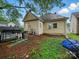 Outdoor area featuring well-maintained lawn and necessary grilling equipment at 211 S Rowan Ave, Spencer, NC 28159