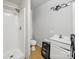 Modest full bathroom with single sink vanity, shower stall, and basic fixtures at 211 S Rowan Ave, Spencer, NC 28159