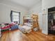 Functional bedroom with wood floors, bunk beds, window, and storage at 211 S Rowan Ave, Spencer, NC 28159