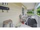 Enjoy the inviting front porch with casual seating, perfect for relaxing and enjoying the neighborhood at 211 S Rowan Ave, Spencer, NC 28159