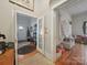 Hallway with hardwood floors leads to the front door at 211 S Rowan Ave, Spencer, NC 28159