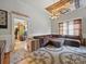 Inviting living room featuring a sectional sofa, chandelier and view into adjacent room at 211 S Rowan Ave, Spencer, NC 28159