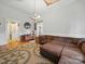 Spacious living room with hardwood floors, warm brown sectional and decorative rug at 211 S Rowan Ave, Spencer, NC 28159
