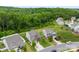 A residential neighborhood showcases well-kept homes and green spaces creating an inviting community atmosphere at 225 Tasman Dr, Mount Holly, NC 28120