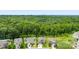 Beautiful suburban houses in a forested neighborhood with tree-lined street views at 225 Tasman Dr, Mount Holly, NC 28120