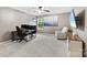 Spacious bonus room with neutral walls, soft carpeting, and a cozy lounge area at 225 Tasman Dr, Mount Holly, NC 28120