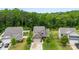 Charming two-story home with a well-manicured lawn and mature trees in a peaceful setting at 225 Tasman Dr, Mount Holly, NC 28120