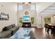Bright living room with a vaulted ceiling, fireplace, and comfortable seating at 225 Tasman Dr, Mount Holly, NC 28120
