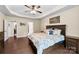 Spacious bedroom with hardwood floors, ceiling fan, and ample natural light from a large window at 225 Tasman Dr, Mount Holly, NC 28120