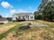 Beautiful backyard featuring a wooden deck, ample yard space, and mature trees at 263 Lauren Pines Dr, York, SC 29745