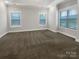 Bright, carpeted bedroom featuring three windows and neutral paint at 263 Lauren Pines Dr, York, SC 29745