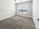 Bright, carpeted bedroom with neutral tones and a ceiling fan at 263 Lauren Pines Dr, York, SC 29745