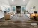 Spacious living room featuring a stone fireplace, neutral decor, and modern furnishings at 263 Lauren Pines Dr, York, SC 29745