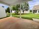 Relaxing back porch overlooks a lush green yard and neighborhood homes at 27415 Cinderella Cir, Lancaster, SC 29720