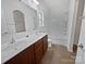 Clean bathroom featuring a double sink vanity, and a shower-tub combo with white tiling and lots of light at 27415 Cinderella Cir, Lancaster, SC 29720