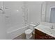 Clean bathroom featuring a single sink vanity, and a shower-tub combo with white tiling and towel rack at 27415 Cinderella Cir, Lancaster, SC 29720