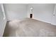 Spacious bedroom features soft carpeting and a view to the en-suite bathroom at 27415 Cinderella Cir, Lancaster, SC 29720