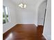 Open dining room with wood floors, chandelier lighting, and natural light at 27415 Cinderella Cir, Lancaster, SC 29720