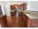 Well-equipped kitchen with granite countertops, stainless steel appliances, and wooden cabinetry, perfect for cooking enthusiasts at 27415 Cinderella Cir, Lancaster, SC 29720