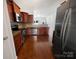 Well-equipped kitchen with granite countertops, stainless steel appliances, and wooden cabinetry, perfect for cooking enthusiasts at 27415 Cinderella Cir, Lancaster, SC 29720