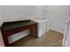 Functional laundry room includes a utility sink, washer, dryer, and shelving at 27415 Cinderella Cir, Lancaster, SC 29720