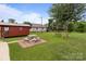 Spacious backyard featuring a picnic area, swing set, and additional red building at 3345 Long Ferry Rd, Salisbury, NC 28146
