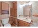 Bathroom with a sink, cabinets, a mirror and an enclosed toilet area at 3345 Long Ferry Rd, Salisbury, NC 28146