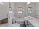 Bathroom featuring a vanity, a white bathtub and large mirror at 3345 Long Ferry Rd, Salisbury, NC 28146