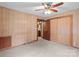 Bedroom featuring a closet, paneled walls and a ceiling fan at 3345 Long Ferry Rd, Salisbury, NC 28146
