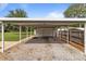 Large carport providing ample covered parking space with a convenient gravel driveway and backyard access at 3345 Long Ferry Rd, Salisbury, NC 28146