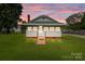 Charming home with a manicured lawn and picturesque sunset backdrop at 3345 Long Ferry Rd, Salisbury, NC 28146
