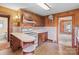 Kitchen features dark wood paneled walls, custom cabinets and white appliances at 3345 Long Ferry Rd, Salisbury, NC 28146