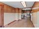 Retro kitchen features wood paneling, classic tile, and a convenient serving pass-through to the adjacent room at 3345 Long Ferry Rd, Salisbury, NC 28146