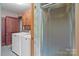 Laundry Room featuring a washing machine, dryer and a walk-in shower at 3345 Long Ferry Rd, Salisbury, NC 28146